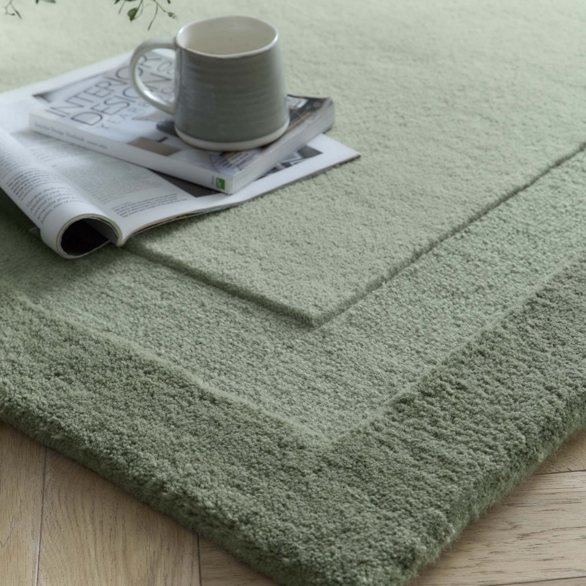 Origins Stacked Border Light Green Wool Rug